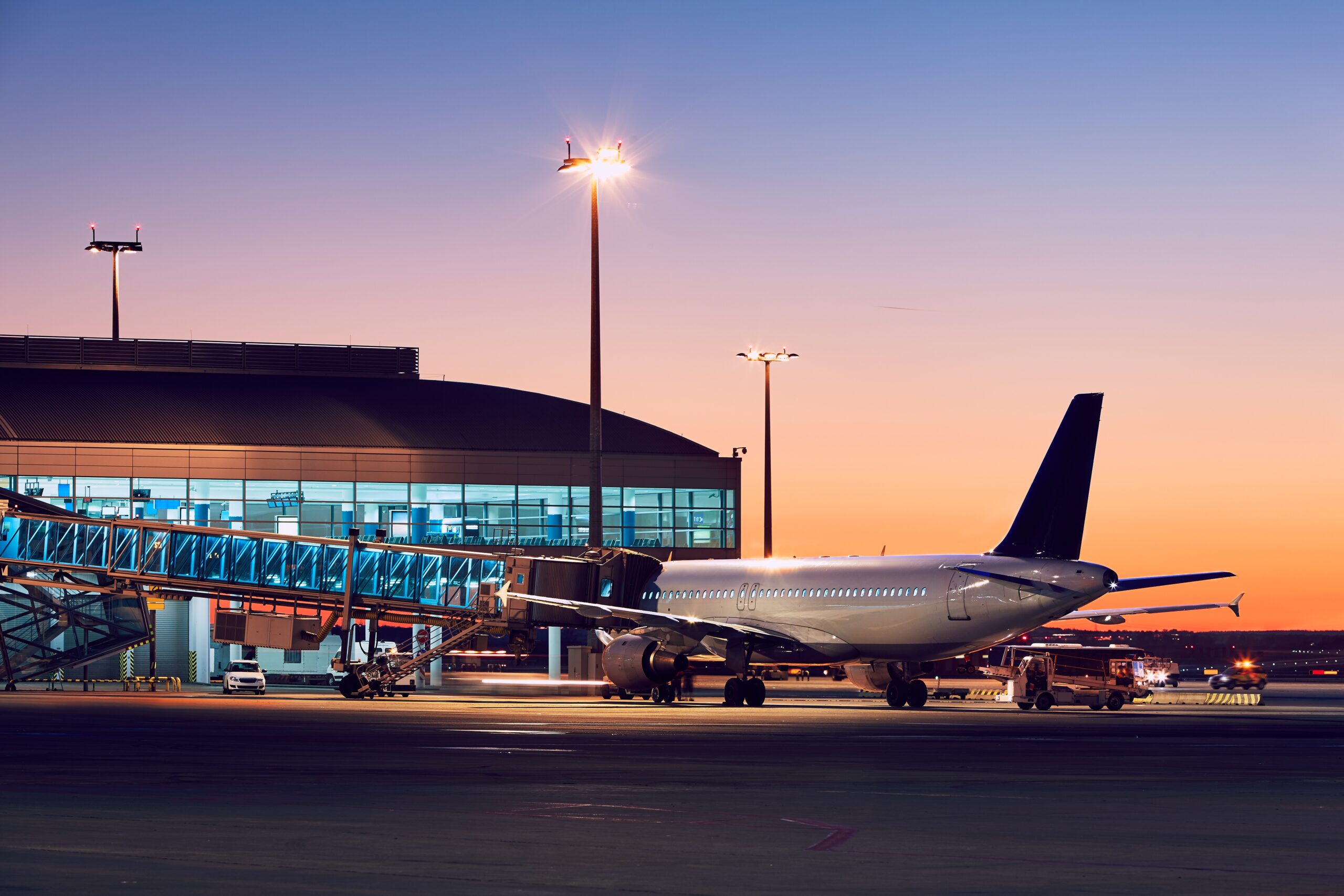 Preparation of the airplane before flight. Airport at the colorful sunset.